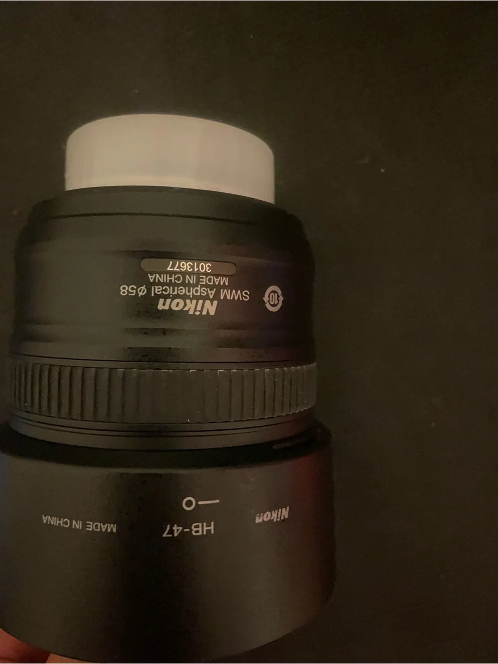 Nikon Black Lens with White Cap and Hood